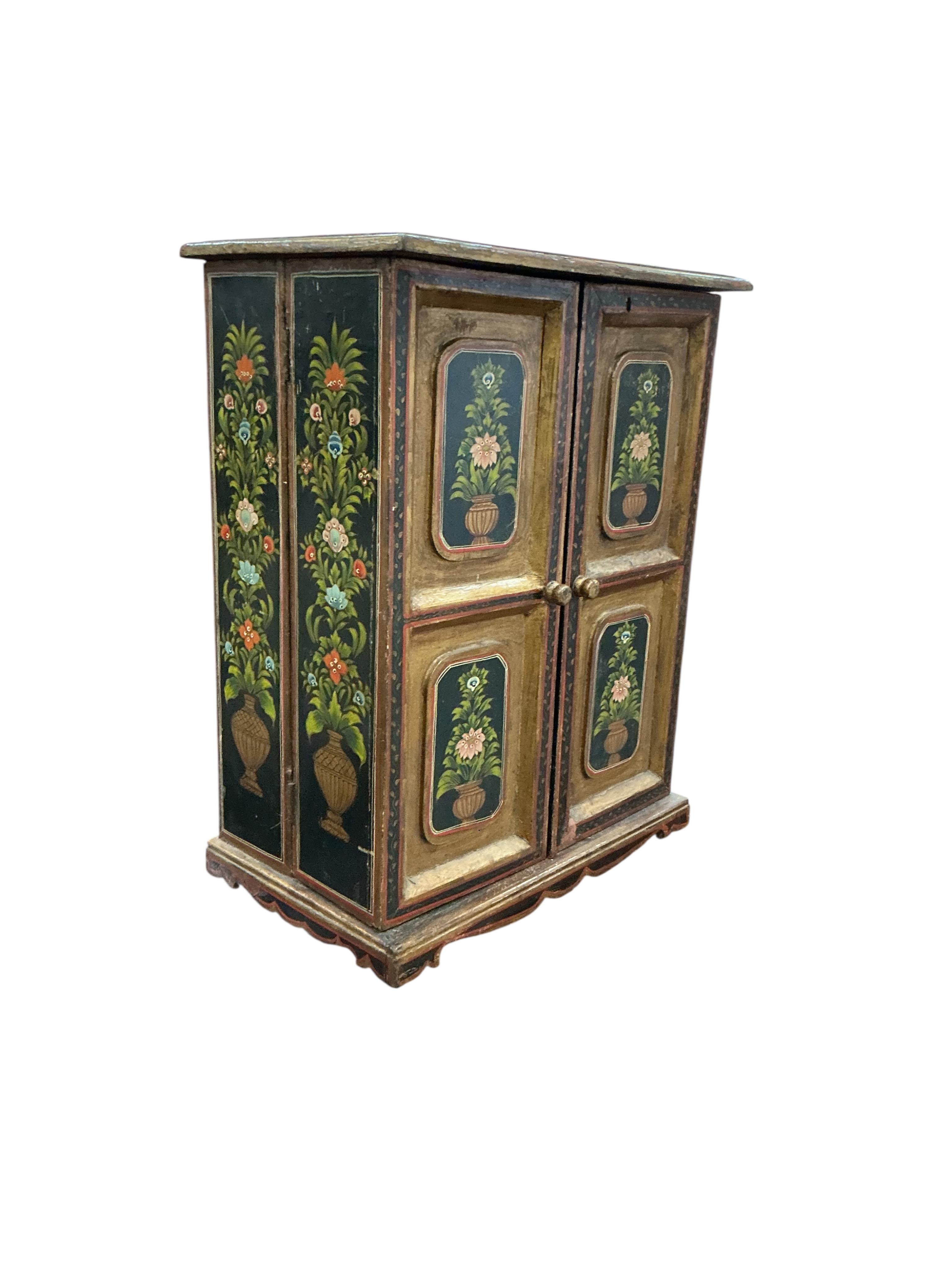 An Indian painted table cabinet, width 46cm, depth 28cm, height 59cm